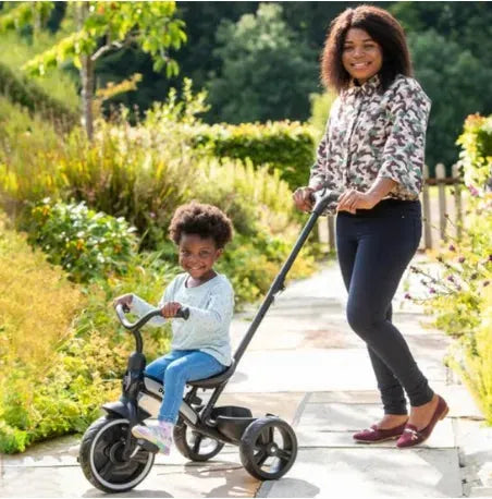 Tricycle avec barre de poussée